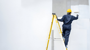 Industrial ladder used by a worker for safe workplace access