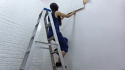 Stainless steel ladder used for safe indoor home maintenance